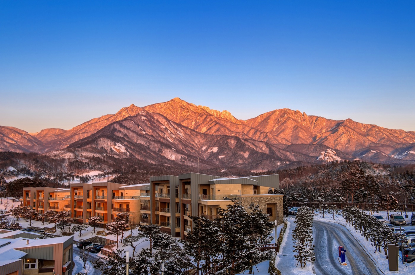 Mountain resort buildings at sunset